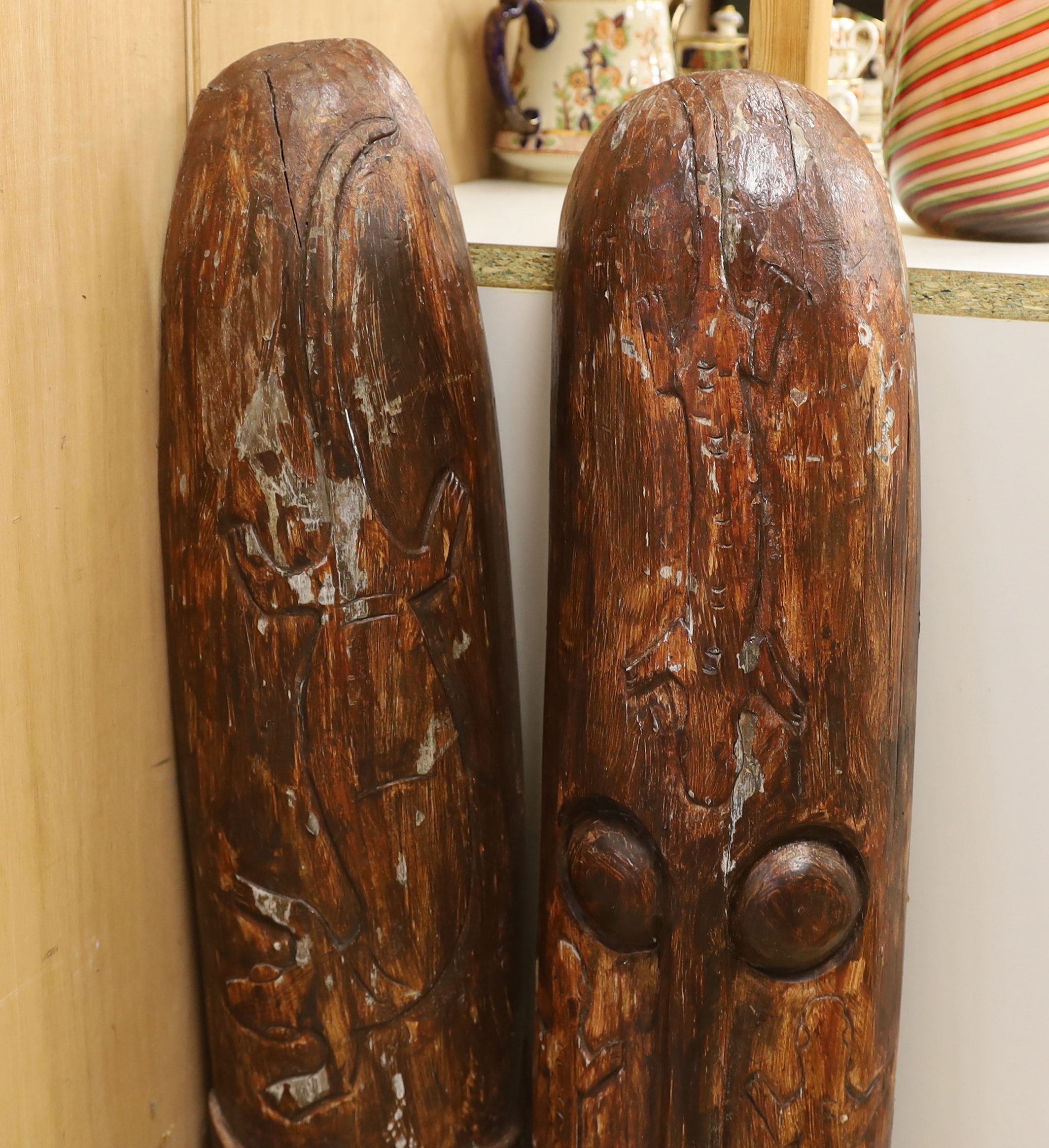 A pair of tribal style masks, 98.5cm